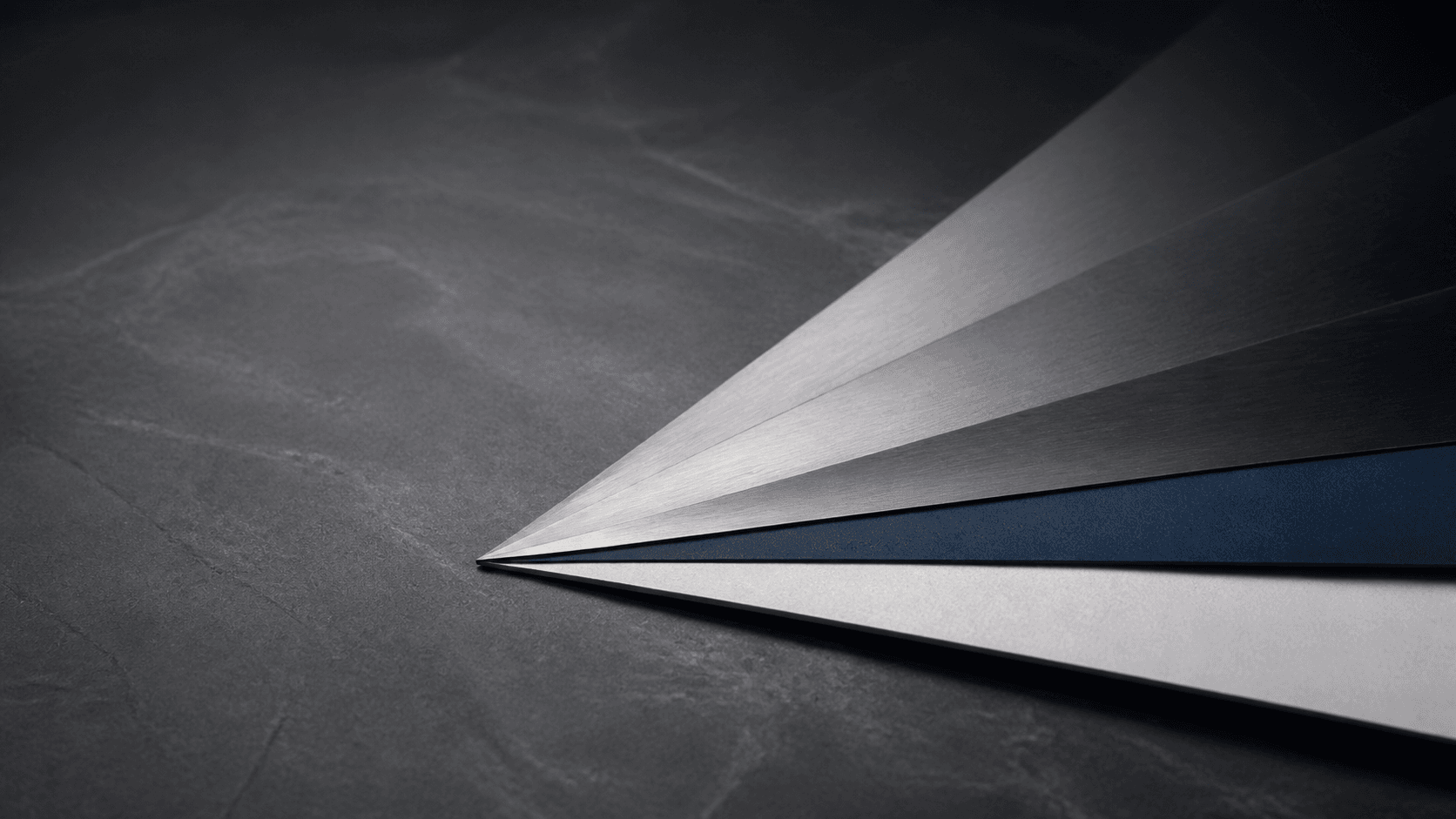 Brushed metal planes converging at a precise capital-allocation point