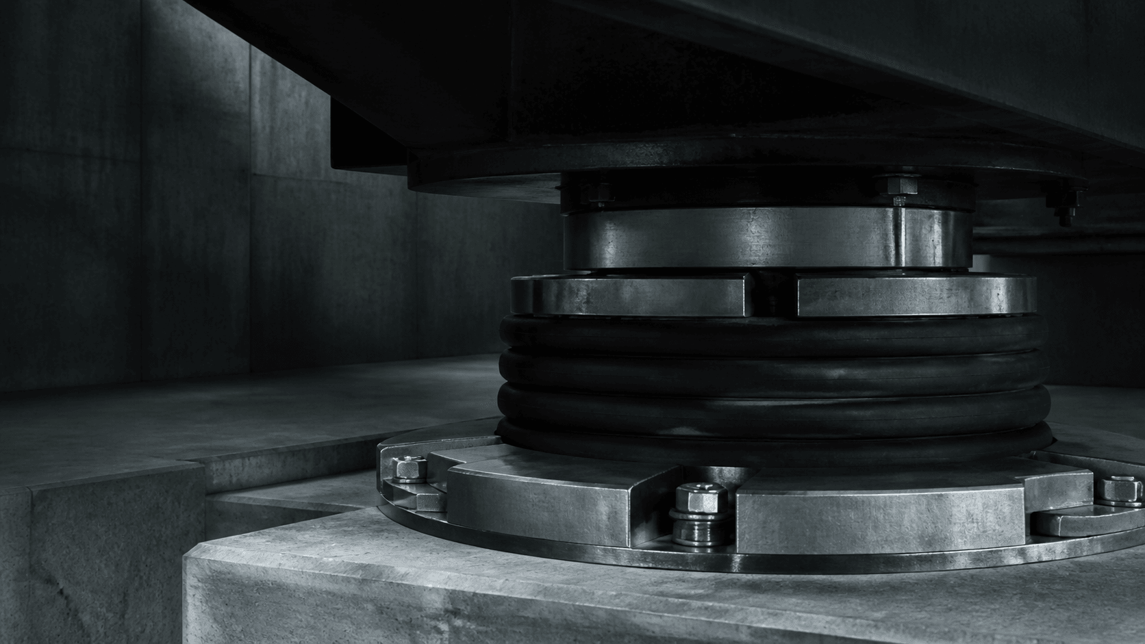 Layered structural bearings designed to absorb and bound exposure