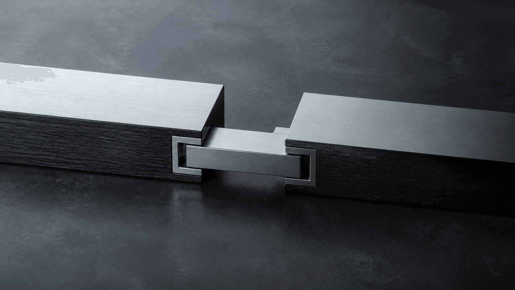 Two structural members joined through a precise continuity bridge